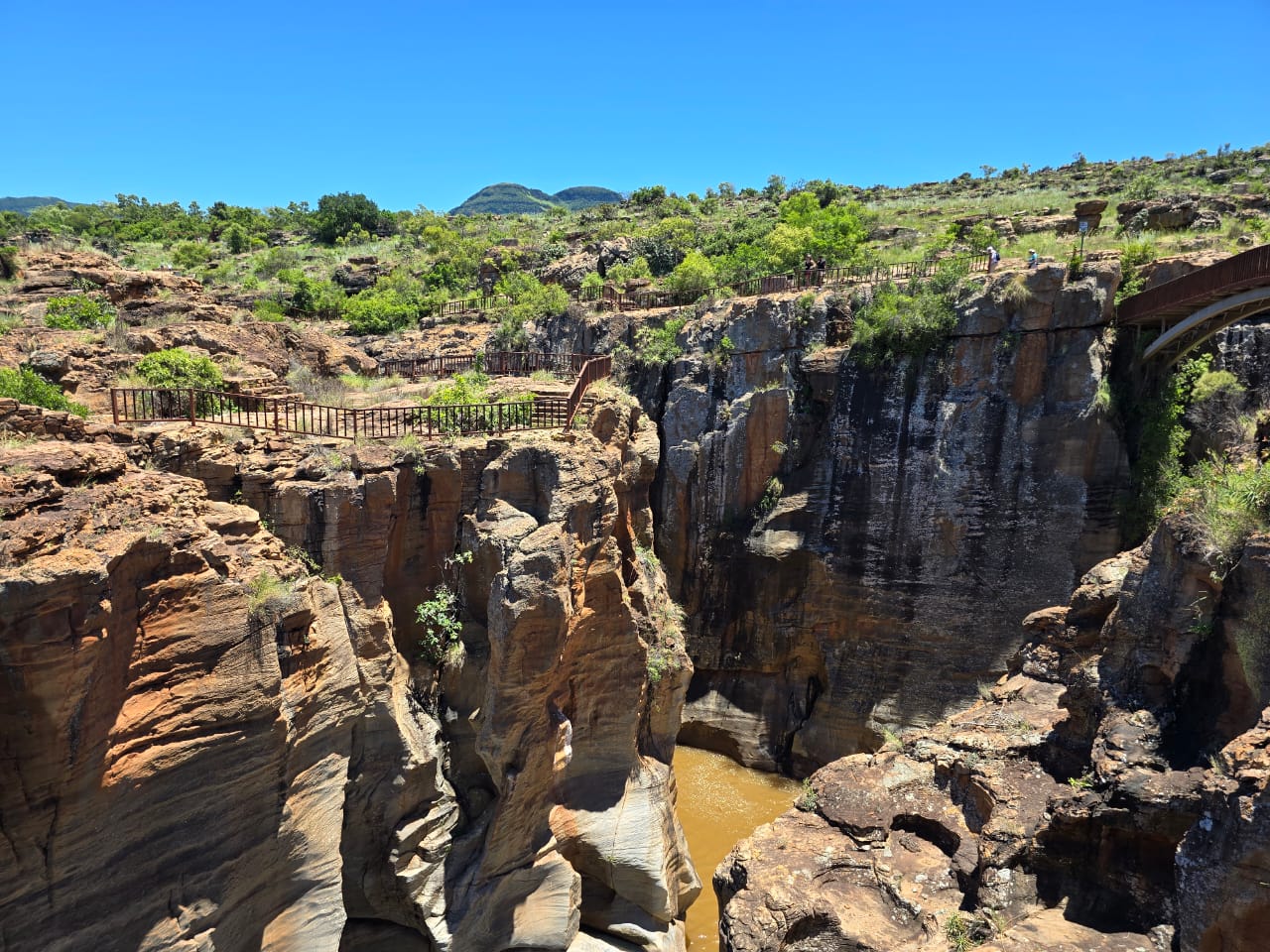 Bourke's Luck Potholes in Mpumalanga with dramatic rock formations and clear pools carved by centuries of swirling river water in the Blyde River Canyon.